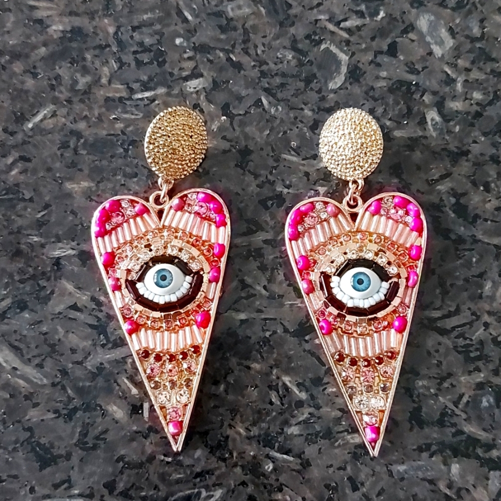 Pink beaded evil eye earrings